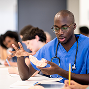 A male doctor learning in a classroom
